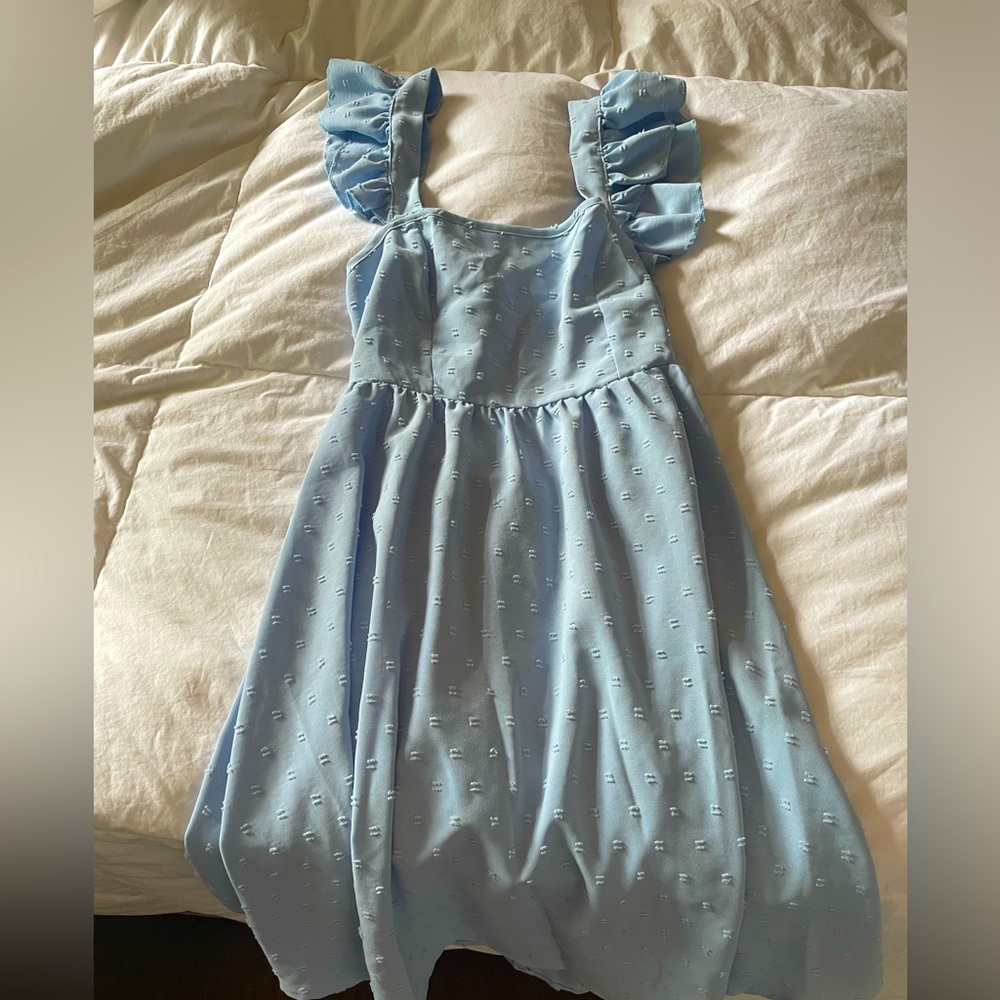 Medium Light blue dress cross tie in back.